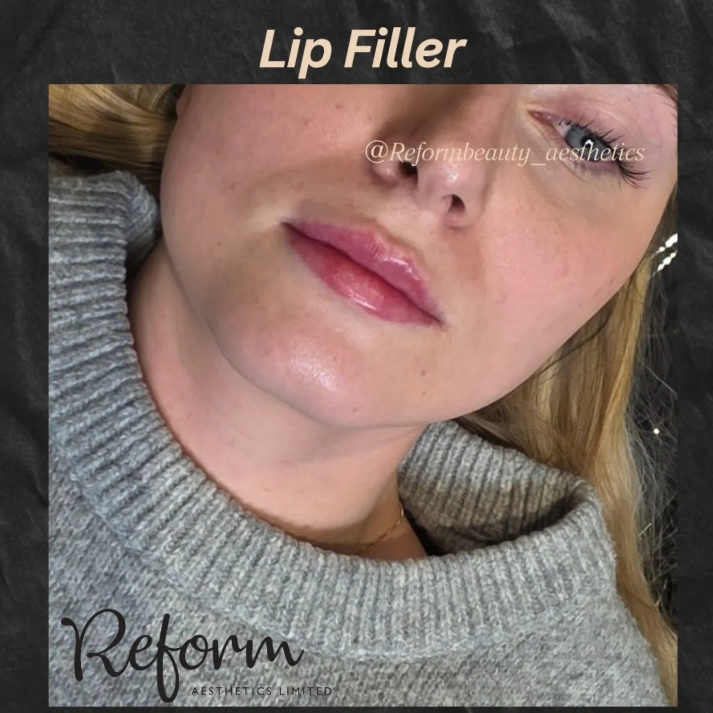 A woman with her eyes closed wearing a sweater.